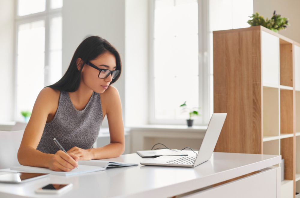 Young woman looking at her laptop.